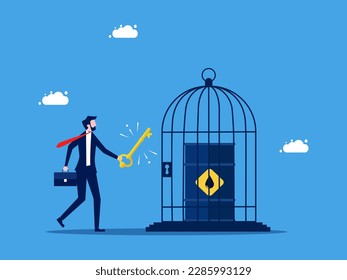 Unlock the price or control the amount of oil. Businessman uses a key to open an oil barrel. business and investment concept