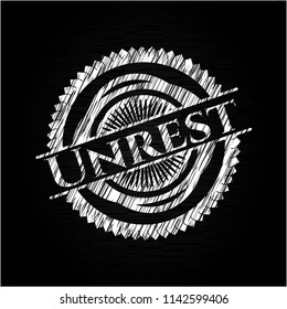 Unrest written with chalkboard texture