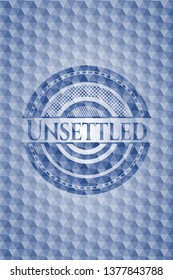 Unsettled blue emblem with geometric pattern.