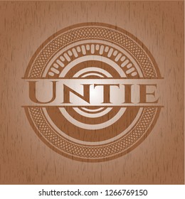 Untie badge with wood background