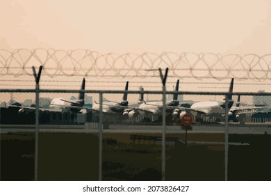 unused planes parking next to each other at the airport