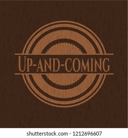 Up-and-coming badge with wooden background