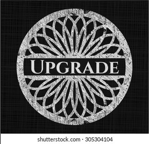 Upgrade chalk emblem written on a blackboard