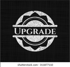 Upgrade chalkboard emblem written on a blackboard
