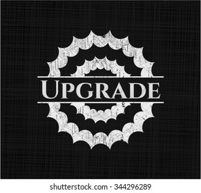 Upgrade chalkboard emblem written on a blackboard