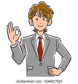 Upper body of young brown haired businessman giving OK sign with hand