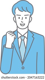 Cuerpo superior de un joven con traje que da un puño para mostrar su motivación (de color)