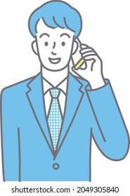 Cuerpo superior de un joven con traje hablando por teléfono móvil (de color)