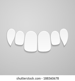 Upper front white teeth on gray background