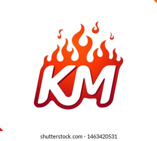 Uppercase initial logo letter KM with blazing flame silhouette,  simple and retro style logotype for adventure and sport activity.