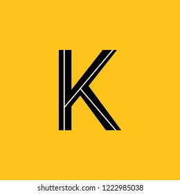 uppercase letter K icon with skeleton structure construction simplified yellow background