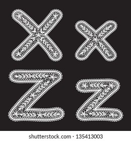 Uppercase and lowercase letters X and Z are written by white lace. Lace type font for the inscriptions.