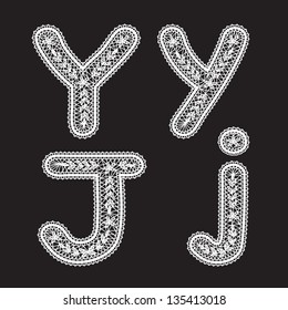 Uppercase and lowercase letters Y and J are written by white lace. Lace type font for the inscriptions.