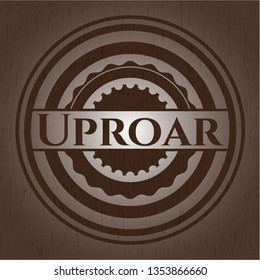 Uproar badge with wooden background