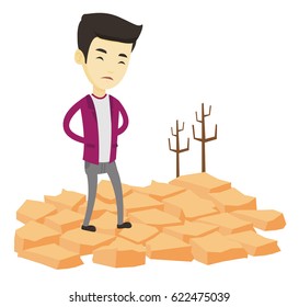 Upset asian man standing in the desert. Young man standing on cracked earth in the desert. Concept of climate change and global warming. Vector flat design illustration isolated on white background.