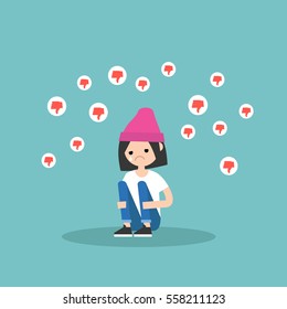 Upset crying girl sitting and hugging her knees surrounded by the dislike symbols / editable flat vector illustration, clip art