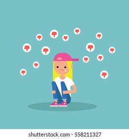 Upset crying girl sitting and hugging her knees surrounded by the dislike symbols / editable flat vector illustration, clip art