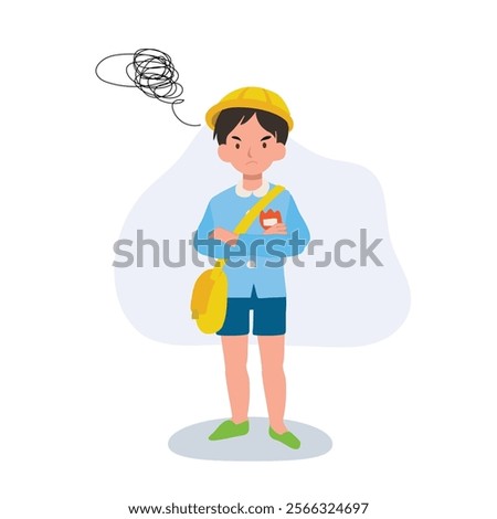 upset kindergarten boy in school uniform with angry expression and crossed arms