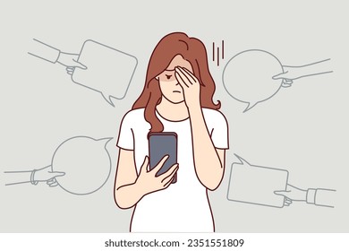 Upset woman with phone suffers from bullying and hate on social networks, receiving offensive messages and comments. Teenager girl is victim of internet bullying and discrimination from classmates