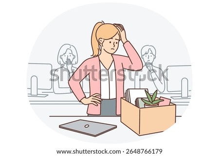 Upset woman standing near table with box after dismissal of manager or secretary position. Sad girl is preparing to leave workplace due to dismissal related to financial crisis or closure of company