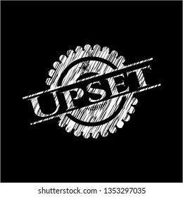Upset written on a blackboard
