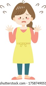 Upset young woman in yellow apron
