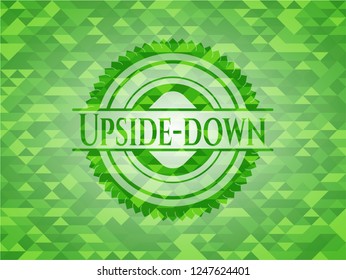 Upside-down green emblem with mosaic background