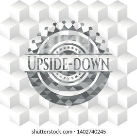 Upside-down grey emblem with geometric cube white background