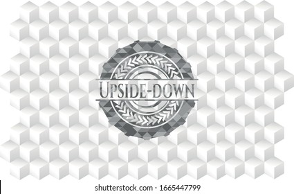 Upside-down grey emblem with geometric cube white background