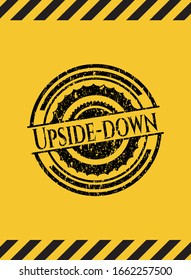 Upside-down grunge black emblem with yellow background, warning sign. Vector Illustration. Detailed.