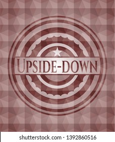 Upside-down red seamless emblem with geometric pattern.