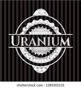 Uranium silvery emblem or badge