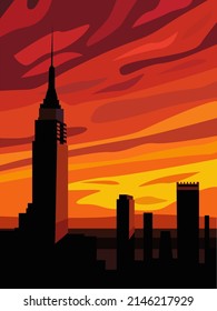 Urban cityscape with silhouettes of buildings against the backdrop of sunset.