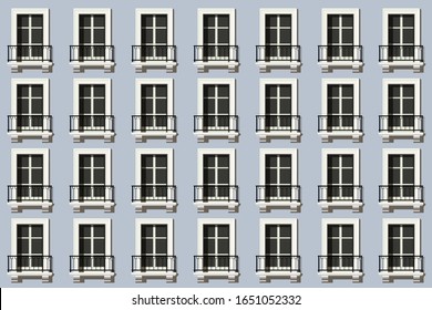 Urban concept, with a facade of a building or a luxury hotel, repeating the identical windows of apartments on several floors.