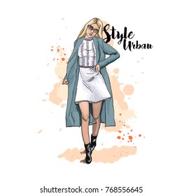 Urban style. Fashionable bow. Clothing for the street. Hand drawn sketch. Stylish young woman in dress and coat. Vector illustration.