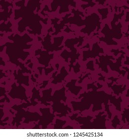 Urban UFO camouflage of various shades of red and dark pink colors. It is a colorful seamless pattern that can be used as a camo print for clothing and background and backdrop or computer wallpaper