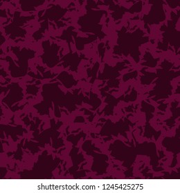 Urban UFO camouflage of various shades of red and dark pink colors. It is a colorful seamless pattern that can be used as a camo print for clothing and background and backdrop or computer wallpaper