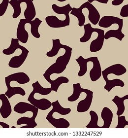 Urban UFO camouflage of various shades of beige and red colors. It is a colorful seamless pattern that can be used as a camo print for clothing and background and backdrop or computer wallpaper