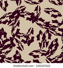 Urban UFO camouflage of various shades of beige and red colors. It is a colorful seamless pattern that can be used as a camo print for clothing and background and backdrop or computer wallpaper