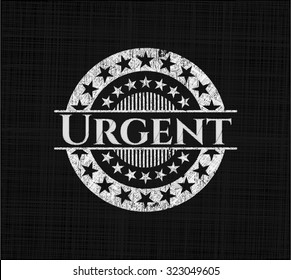 Urgent chalk emblem written on a blackboard