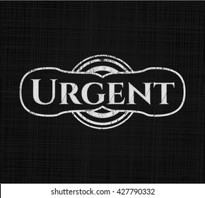 Urgent chalk emblem written on a blackboard