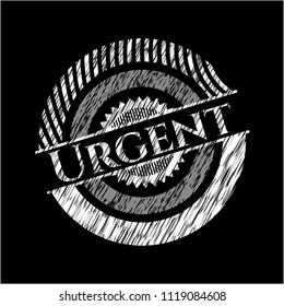 Urgent chalkboard emblem written on a blackboard