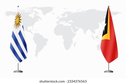 Uruguay and East Timor flags for official meeting against background of world map.