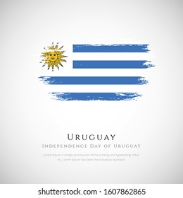 Uruguay flag made in brush stroke background. Independence day of Uruguay. Creative Uruguay national country flag icon. Abstract painted grunge style brush flag background.