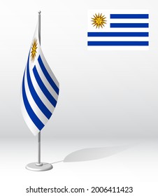 Uruguay flag on flagpole for registration of solemn event, meeting foreign guests. National independence day of Uruguay. Realistic 3D vector on white