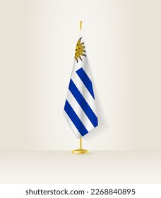 Uruguay flag on a flag stand. Vector illustration.