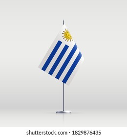 Uruguay flag state symbol isolated on background national banner. Greeting card National Independence Day of the eastern republic of Uruguay. Illustration banner with realistic state flag.
