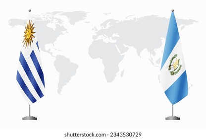 Uruguay and Guatemala flags for official meeting against background of world map.