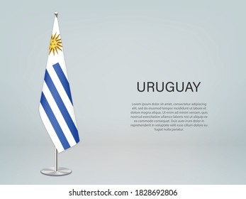 Uruguay hanging flag on stand. Template for politic conference banner