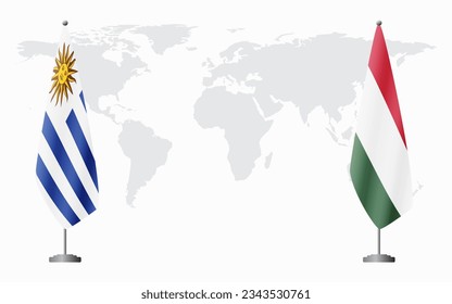 Uruguay and Hungary flags for official meeting against background of world map.
